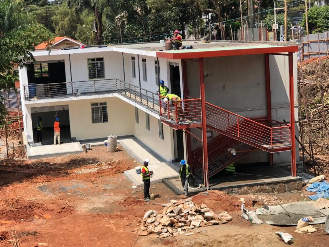Two-storey modular building with red exterior stairs